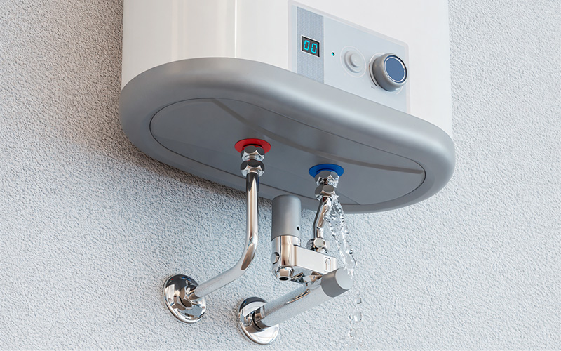 Wall-mounted water heater with hot and cold pipes.